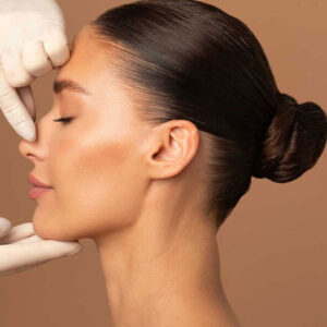 What is the goal of rhinoplasty?